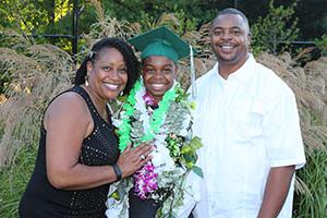 Proud graduate with parents